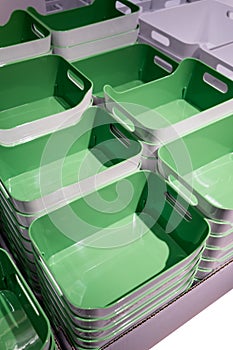 Stack of green plastic trays arrangement for background