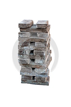 Stack of grey concrete curbs isolated on white background closeup