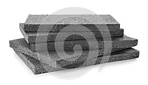 Stack of grey styrofoam sheets on white background