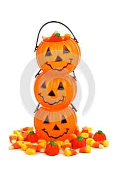 Stack of Halloween Jack o Lantern candy holders over white