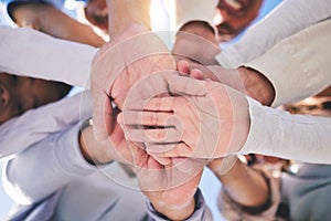 Stack of hands, diversity and people in collaboration for global support and success. Teamwork, palm and low angle of