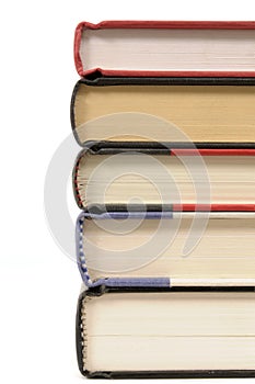 Stack of hardback books, border, edge view, isolated on white background, copy space photo