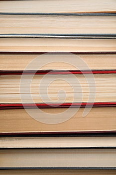 Stack of hardcover books as background