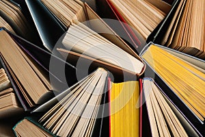 Stack of hardcover books as background