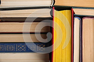 Stack of hardcover books as background