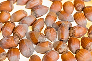 Close up stack of hazelnut with blur yellow background
