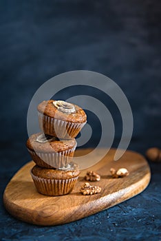 Stack of Healthy vegan banana walnut muffins. Side view, copy space