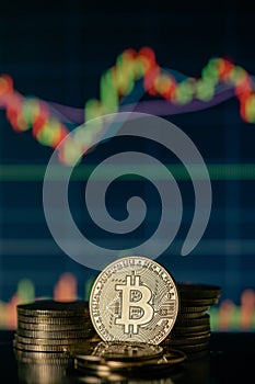 Gold Bitcoins with candle stick graph chart and digital background