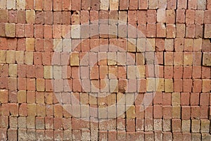 Stack and heap of red bricks background