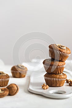 Stack of Homemade vegan banana walnut muffins. Side view, copy space