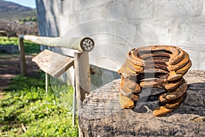 Stack of Horse Shoes on Log