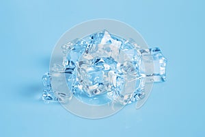 stack of ice cubes on blue