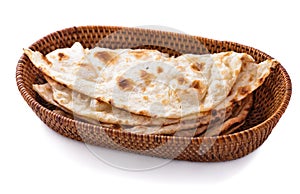 Stack of indian naan bread in small basket