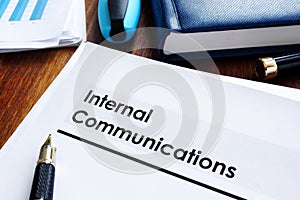 Stack of internal communications documents photo