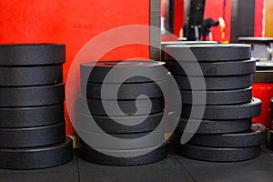 A stack of iron disc weights in a gym