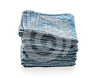 stack of jeans folded on white background