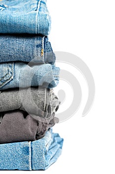 Stack of jeans isolated on white background. Clipping path included