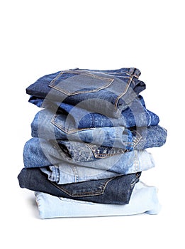 Stack of jeans pants on white background - Image