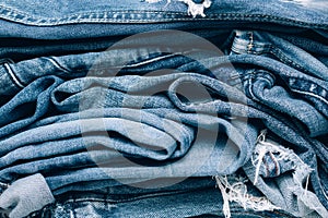Stack of jeans on table. Zero vaste concept