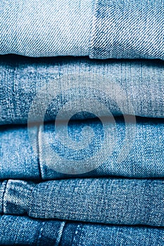 Stack of jeans on table. Zero vaste concept