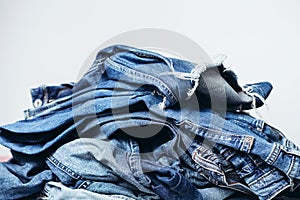 Stack of jeans on table. Zero vaste concept