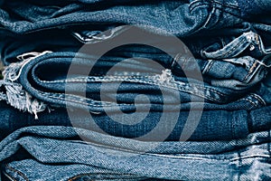 Stack of jeans on table. Zero vaste concept