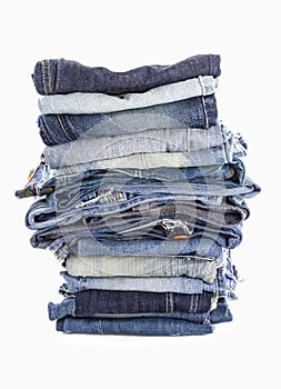 Stack of jeans on white background