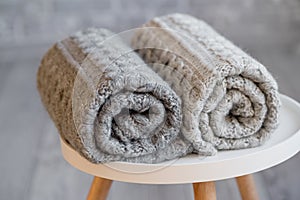 A stack of knitted handmade plaids