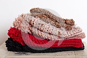 Stack of knitted hats on a table