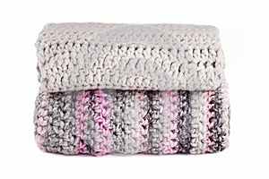 Stack of knitted scarfs isolated on white background