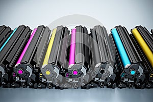 Stack of laser printer CMYK toners. 3D illustration