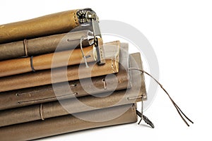 A Stack Of Leather-Bound Journals, Notebooks, Wallets & Cases