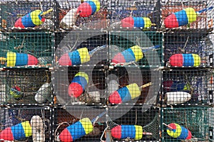 Stack of lobster traps with colorful buoys
