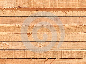 Stack of lumber boards background or texture concept