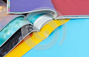 Stack magazines on blue background