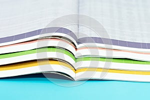 Stack of magazines on blue background
