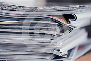 A stack of magazines, close-up macro filled the frame. A background for publishing or informational articles.