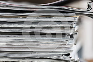 A stack of magazines, close-up macro filled the frame. A background for publishing or informational articles.