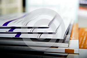 stack of magazines in the library background