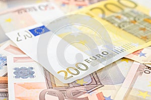 Stack of many 50 euro and one 200 euro banknote