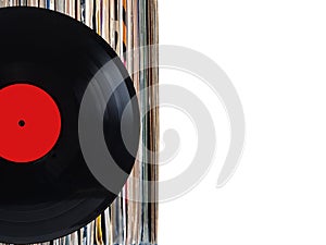 Stack of many vinyl records in old color covers on left side on photo on white background