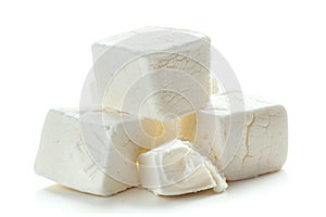 A stack of marshmallows on a clean, white surface