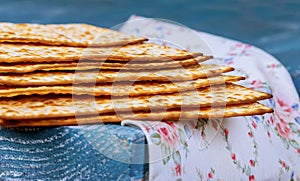 Stack of matzah or matza on a vintage wood background with copy space.