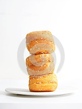 Stack of meat-flossed bread against a white backdrop.