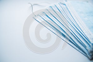 A stack of  medical masks on a white background.