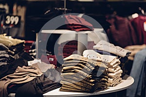 Stack of men clothes in men`s clothing store