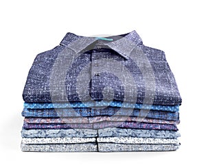 Stack of men`s shirts isolated