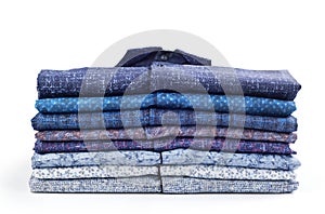 Stack of men`s shirts isolated