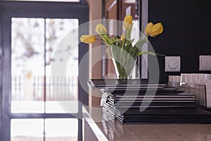 Stack of menus lying on table at a coffee shop on a winter day.