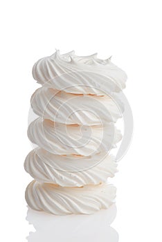 Stack of meringue nests on white photo